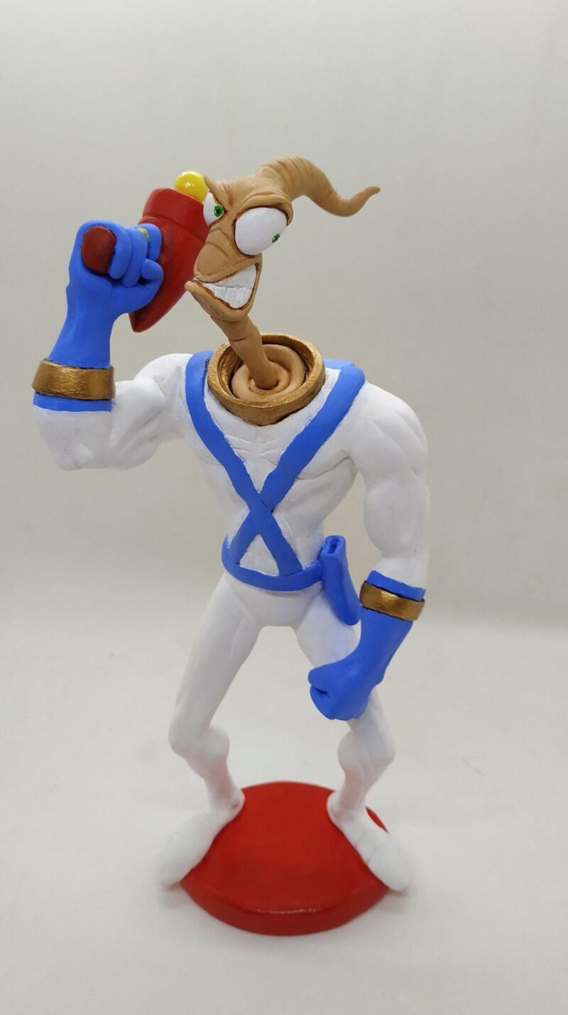 Earthworm Jim with 3 additional heads & moon craters display stand. Size: 25 cm Price: 30.000 ISK